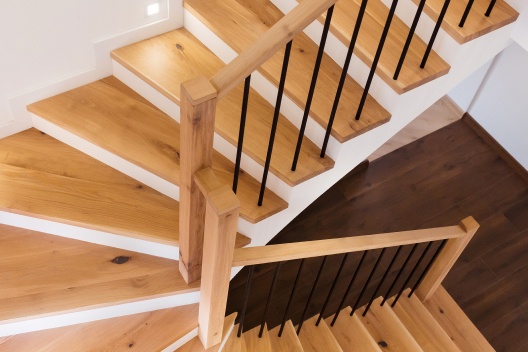 hardwood staircase with iron spindles